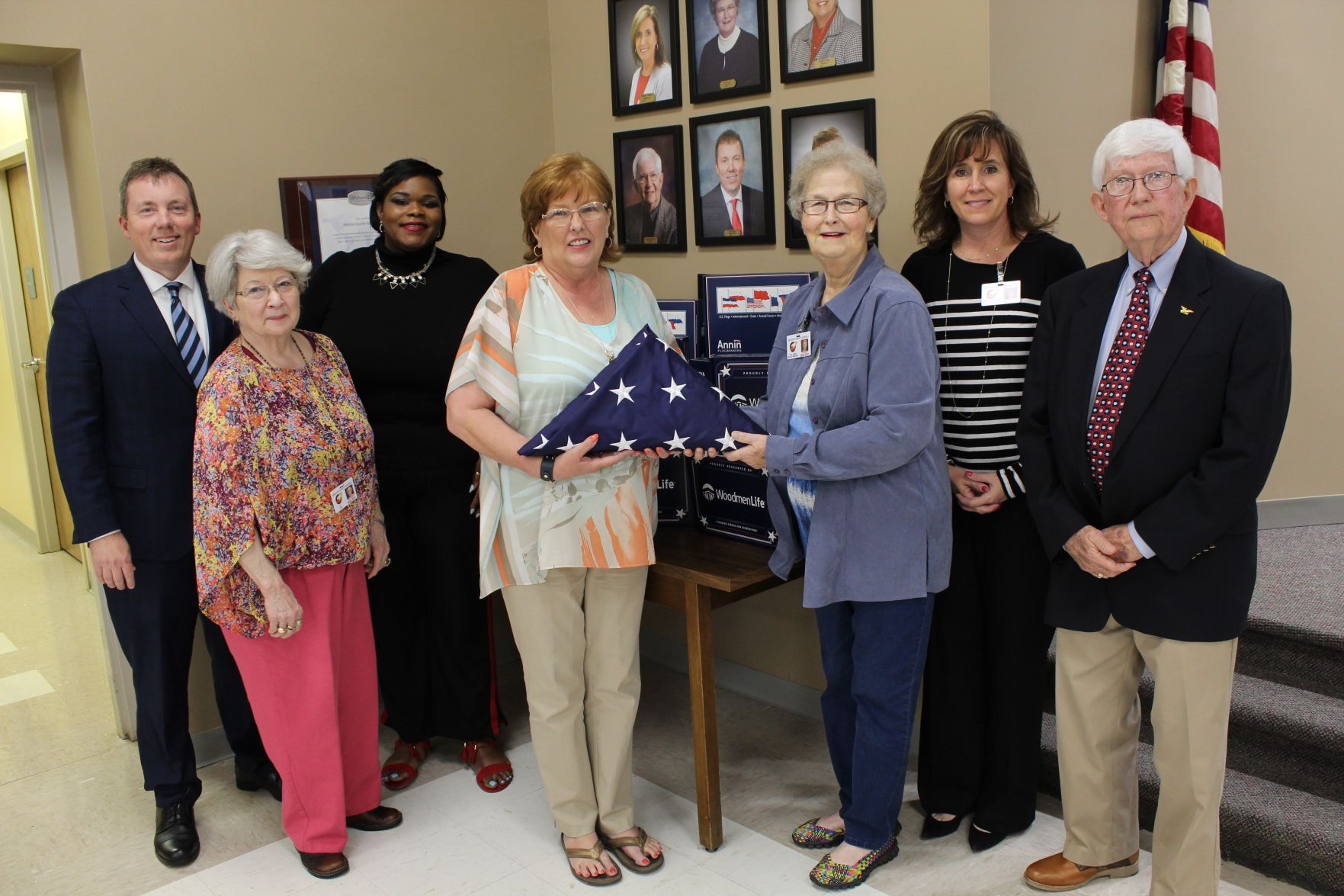 Woodmen Life presents flags to schools